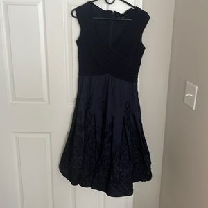 Navy cocktail dress with flower detail